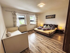 Cozy retreat with a single bed, bedside table, and radiator.