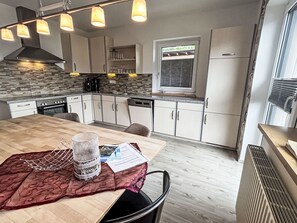 Enjoy cooking in this well-equipped kitchen with a central island, oven, and dishwasher.