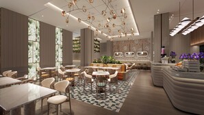 A modern hotel lobby with a central seating area, a bar, and a reception desk. - EVEN Hotel Linyi Airport Zone by IHG (Linyi)