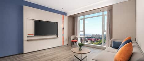 A modern living room with a large TV, a sofa, and a view of the city.