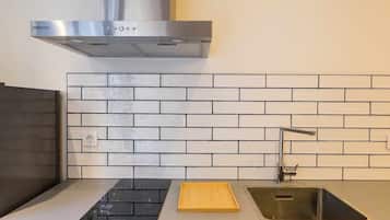 Fridge, microwave, coffee/tea maker, cookware/dishes/utensils