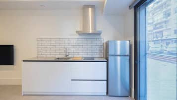 Fridge, microwave, coffee/tea maker, cookware/dishes/utensils