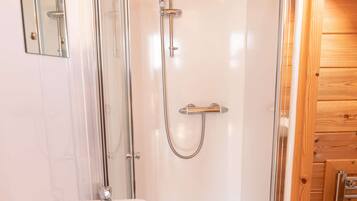 Shower, towels, soap, toilet paper