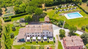 An aerial view of a property with a large building, a swimming pool, and well-maintained gardens. - Francigena by Interhome (Castelfiorentino)