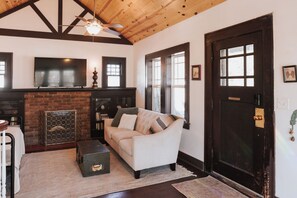 Smart TV, fireplace, books, printers