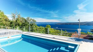 A swimming pool with a clear view of the sea and hills in the background. - Filip & Katja by Interhome (Mošćenička Draga)