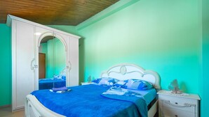 A bedroom with a bed, a wardrobe, and a nightstand. - Vacation home Medica by Interhome (Pazin)