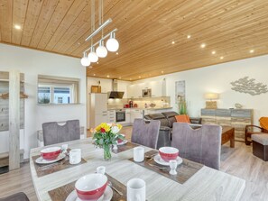 A modern kitchen with white cabinets, a microwave, and a coffee machine. - Vacation home Heide by Interhome (Seebad Altefähr)