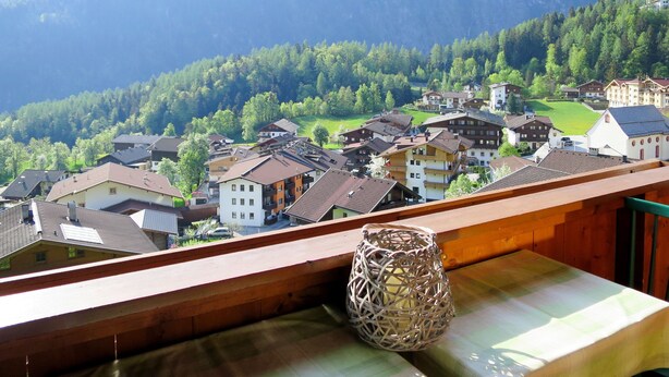 A mountain village with traditional buildings and a view of the forested hills. - Mitterer by Interhome (Finkenberg)