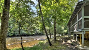A riverside view with a building adjacent to the water. - Riverside relaxation and all the comforts of home! - Aska River House (Blue Ridge)