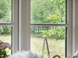 A window with a view of a grassy area and trees. - Röshult by Interhome (Kyrkhult)