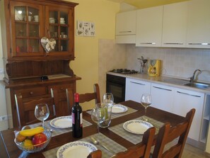 Fridge, oven, toaster, cookware/dishes/utensils