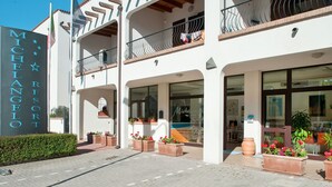 A building with a sign reading "Michelangelo Resort".