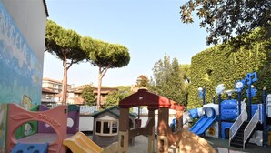 A playground with various play structures including slides and climbing areas. - Apartment Alba by Interhome (Lido di Spina)