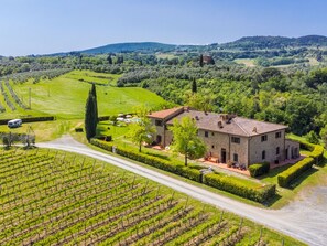 Escape to a serene countryside retreat surrounded by lush vineyards and rolling hills.