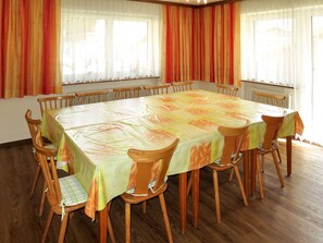 Enjoy meals in this inviting dining area with a large table and comfortable chairs.