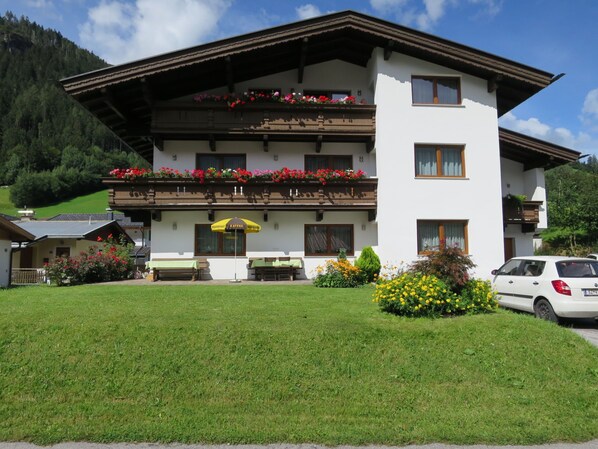 Situated in a lush valley, this traditional Alpine-style building offers a serene atmosphere.