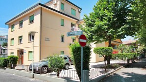 A two-story building with a sign indicating 'Villa Gaby' and a 'via Isonzo' street sign. - Villa Gaby by Interhome (Lignano Sabbiadoro)