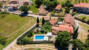 An aerial view of a residential area with multiple houses, a swimming pool, and surrounding greenery. - Villa San Giacomo by Interhome (Poreč/Kaštelir)