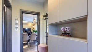 A modern interior with a dining area, a wooden floor, and a minimalist design. - Vacation home Sara by Interhome (Poreč/Kaštelir)
