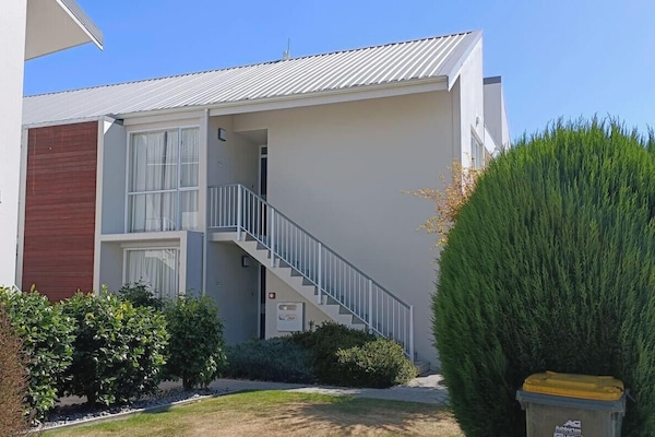 Your apartment is on the right up the stairs.