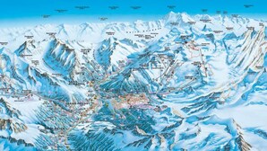 Eine detaillierte topografische Karte eines Gebirges mit markierten Skipisten, Gipfeln und Ortschaften.