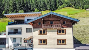 A multi-story building with a modern design, featuring a balcony on the upper floor and a garage at the base. - Apartment Jäger by Interhome (Kappl)