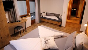 A modern room with a bed, a sofa, a desk, and a TV. - The Siegele by Interhome (Kappl)