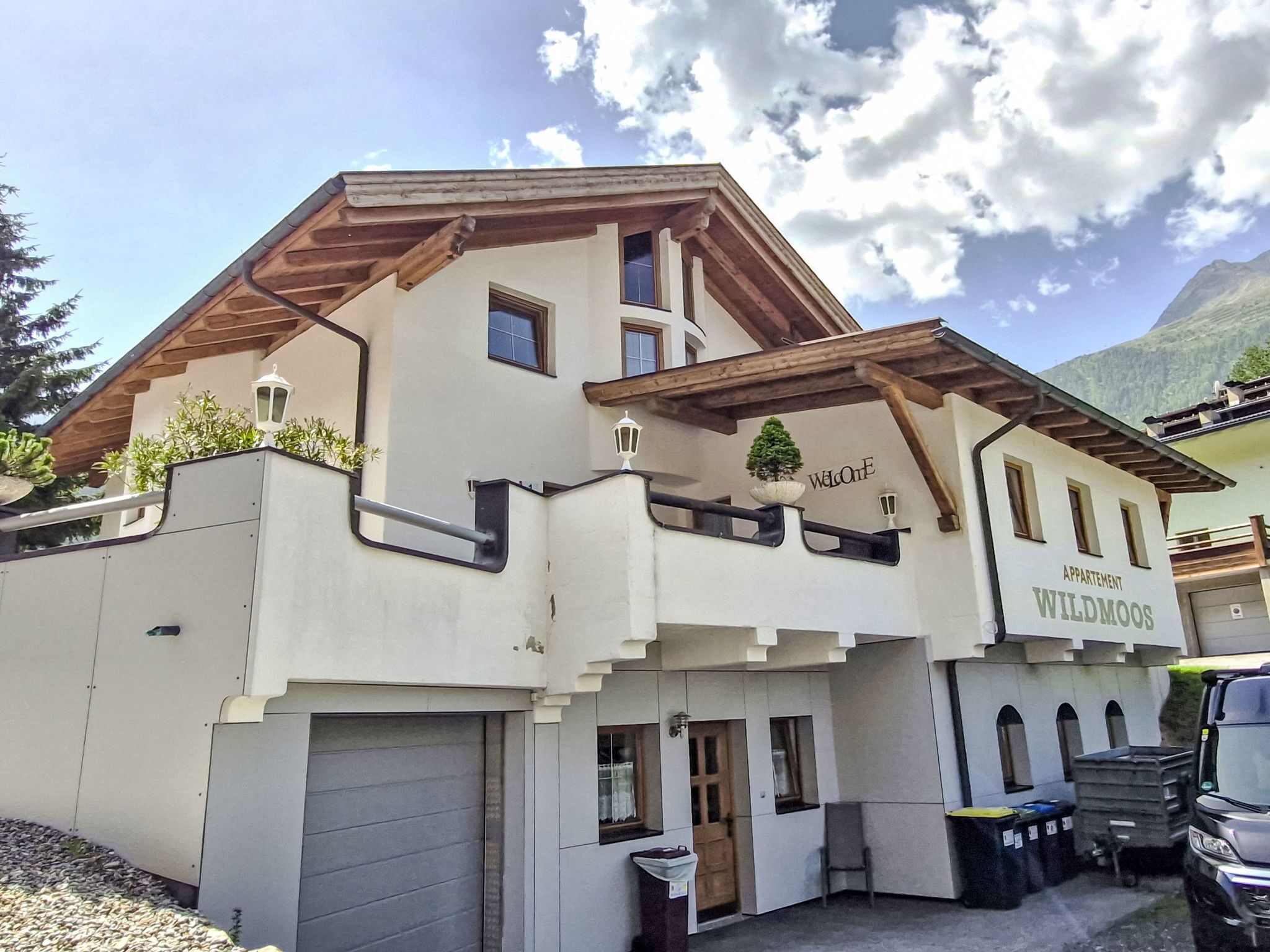A two-story building with a sign reading "Welcome to Wildmoos."