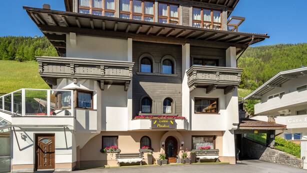 A two-story building with a balcony, a sign reading "Garnis Nadine," and a staircase leading to a second floor. - Apartment Nadine by Interhome (Sölden)