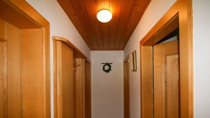 A hallway with wooden doors and a wooden ceiling. - Schusterhäusl by Interhome (Mayrhofen)