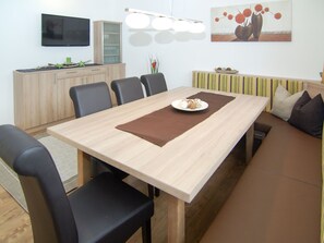 Enjoy meals in this dining area with a rectangular table and comfortable seating for six.