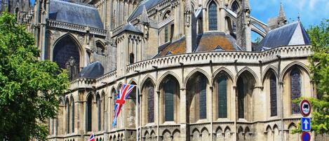 A historic cathedral with Gothic architecture, featuring pointed arches and a large central spire.