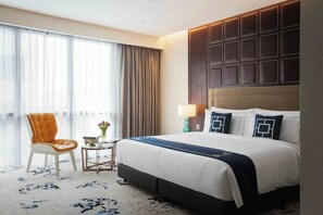 Deluxe tweepersoonskamer | Een kluis op de kamer, verduisterende gordijnen, gratis wifi, beddengoed