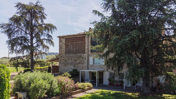 A stone building with a patio and garden. - Rustico dei Canali by Interhome (Lucca)