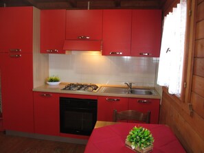 Fridge, oven, high chair, cookware/dishes/utensils