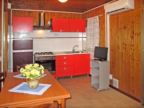 Fridge, oven, high chair, cookware/dishes/utensils