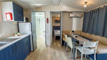 Fridge, microwave, cookware/dishes/utensils, dining tables