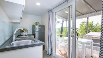 Fridge, highchair, cookware/dishes/utensils, dining tables