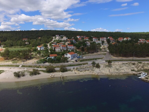 A coastal village with houses, a beach, and a clear sky. - Apartment Nika by Interhome (Zadar)