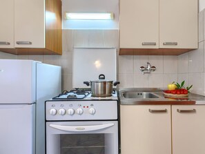 Fridge, oven, cookware/dishes/utensils