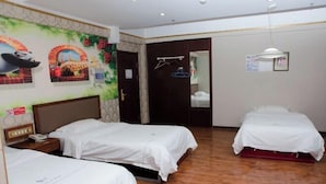A hotel room with two beds, a wooden floor, a mural with animals, and a door leading to another room. - Wudi Business Hotel (Hunchun)