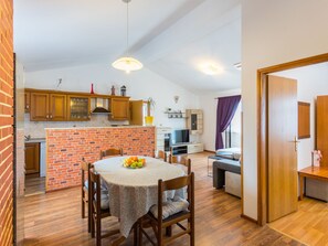 Cozy living space with a kitchen, dining area, and seating space.