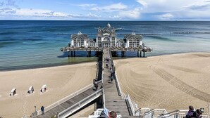 A pier extending into the sea with a building at the end. - Seepark Sellin by Interhome (Ostseebad Sellin)
