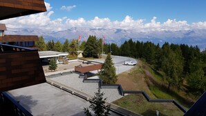 A modern building with a rooftop terrace overlooking a mountainous landscape. - Greppon 306 by Interhome (Thyon-Les Collons)