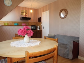 Enjoy meals in this well-appointed dining area with a round table for two, microwave, and coffee maker.