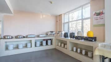 A breakfast bar with various food containers and appliances.