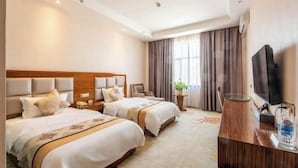 A hotel room with two beds, a TV, a desk, and a window with curtains. - Yanhong Hotel (Jiayuguan Xiongguan Plaza) (Jiayuguan)