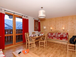 Enjoy a meal for two in this inviting dining area with a view of the surrounding mountains.