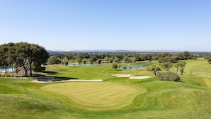 A golf course with a clear view of the landscape, including trees, water bodies, and distant hills. - Provence Country Club by Interhome (L'isle sur la Sorgue)